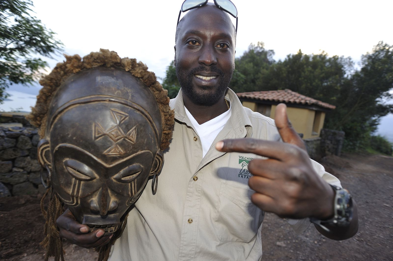 Amon Holding an African sculpture.