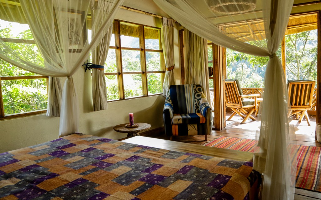 Bwindi Lodge banda bedroom interior and veranda