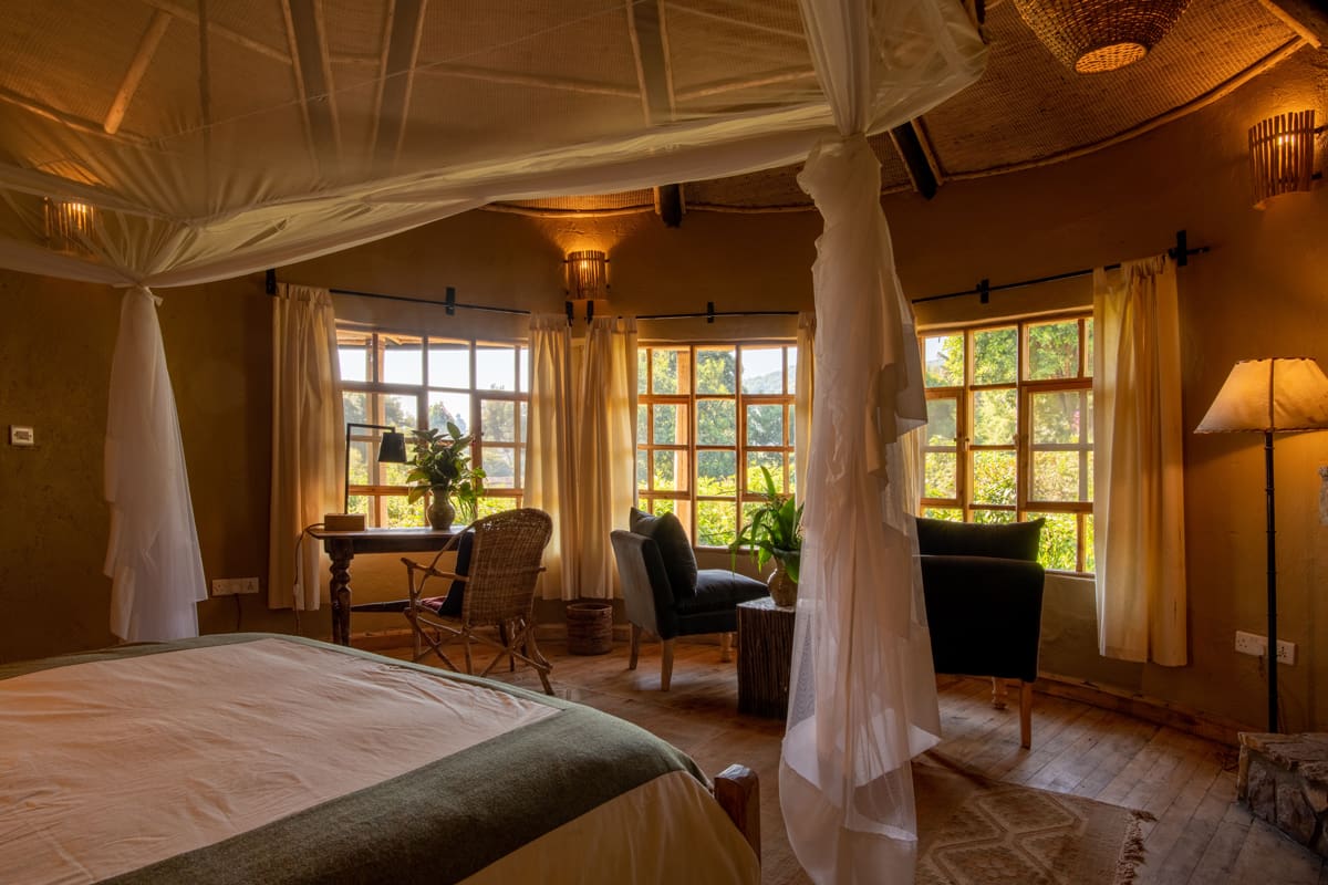 volcanoes-safaris-mount-gahinga-lodge-looking-out-bedroom