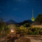 volcanoes safaris mount gahinga lodge night time view outside