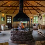 volcanoes safaris mount gahinga lodge lounge fireplace